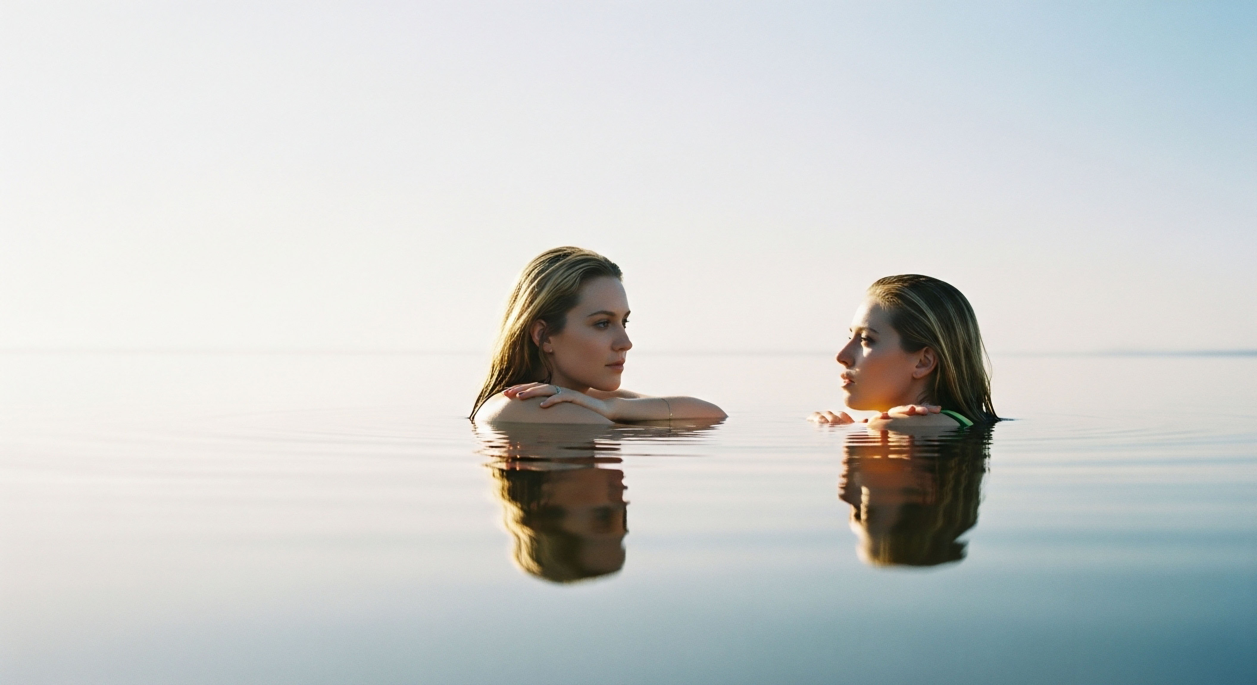 Two individuals immersed in calm water reflect achieved hormone optimization and metabolic health. Their serenity symbolizes cellular vitality, showcasing clinical wellness and positive therapeutic outcomes from patient-centric protocols and peptide science