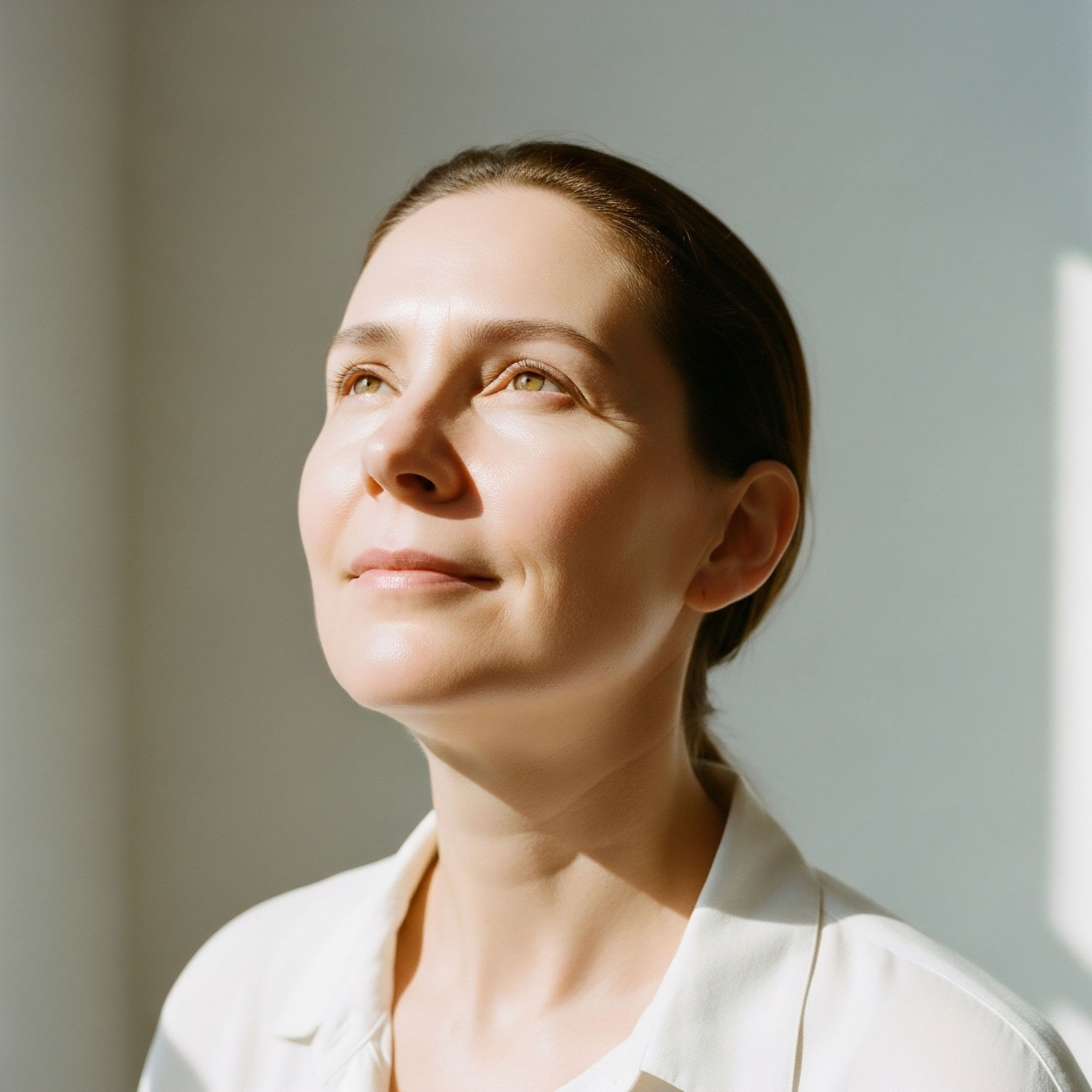 A patient with radiant skin, eyes uplifted, embodying the positive outcomes of hormone optimization and metabolic health. Her serene expression reflects cellular function improvement and physiological harmony from clinical protocols