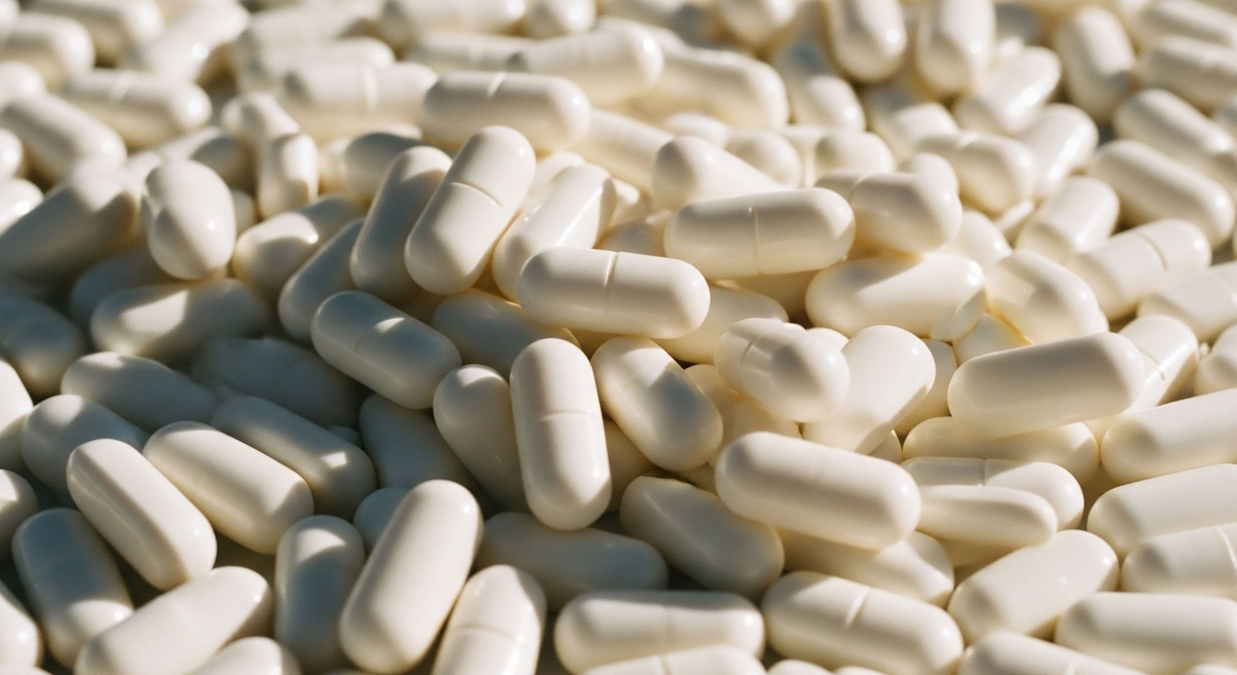 Numerous white capsules, representing precise therapeutic agents for hormone optimization and metabolic health. Essential for cellular function, these compounds support advanced peptide therapy and TRT protocols, guided by clinical evidence