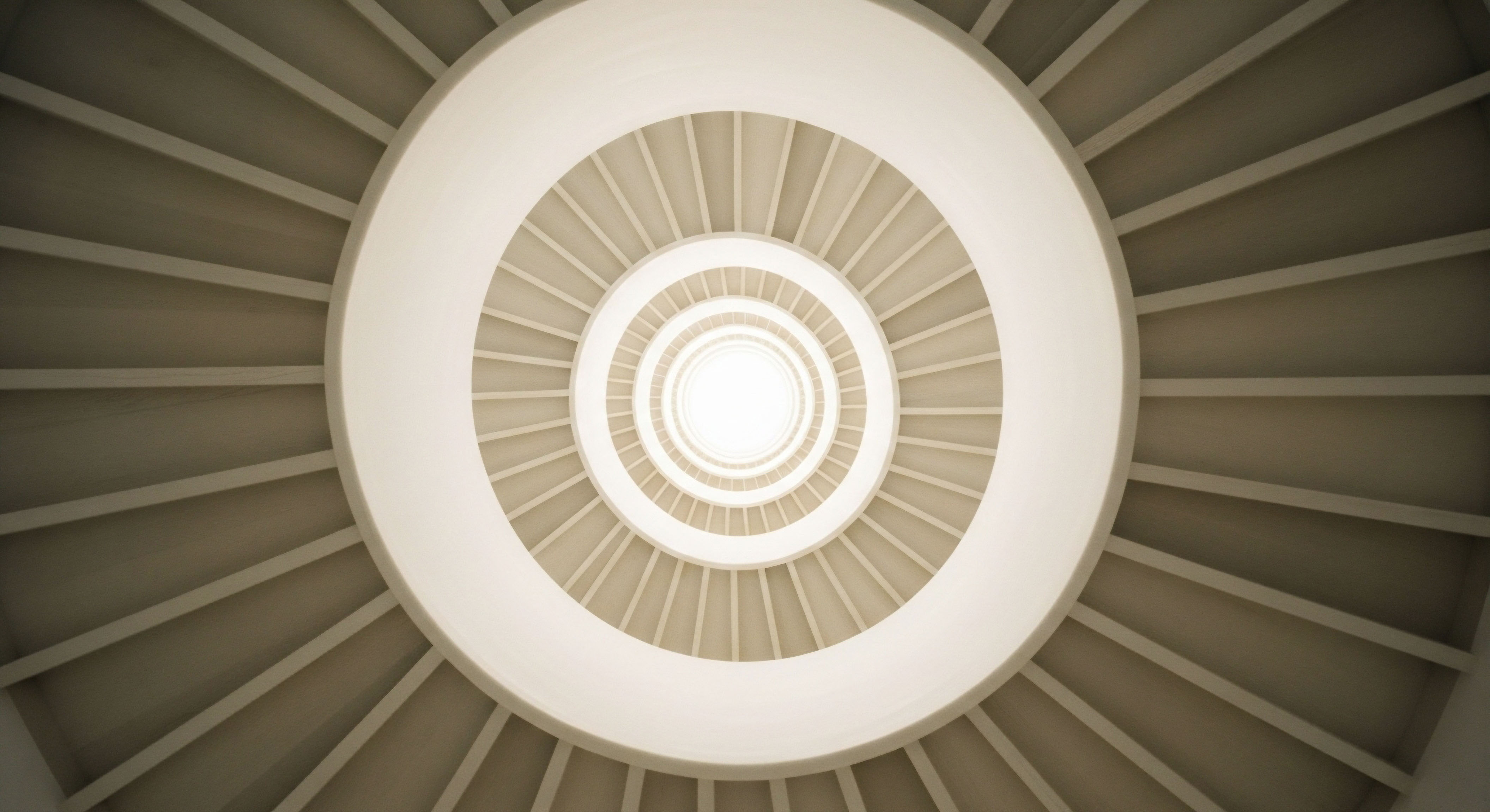 An upward view of a spiral staircase, signifying the progressive patient journey in hormone optimization. It illustrates structured clinical protocols and personalized treatment leading to enhanced cellular function, metabolic health, and systemic balance via precision endocrinology